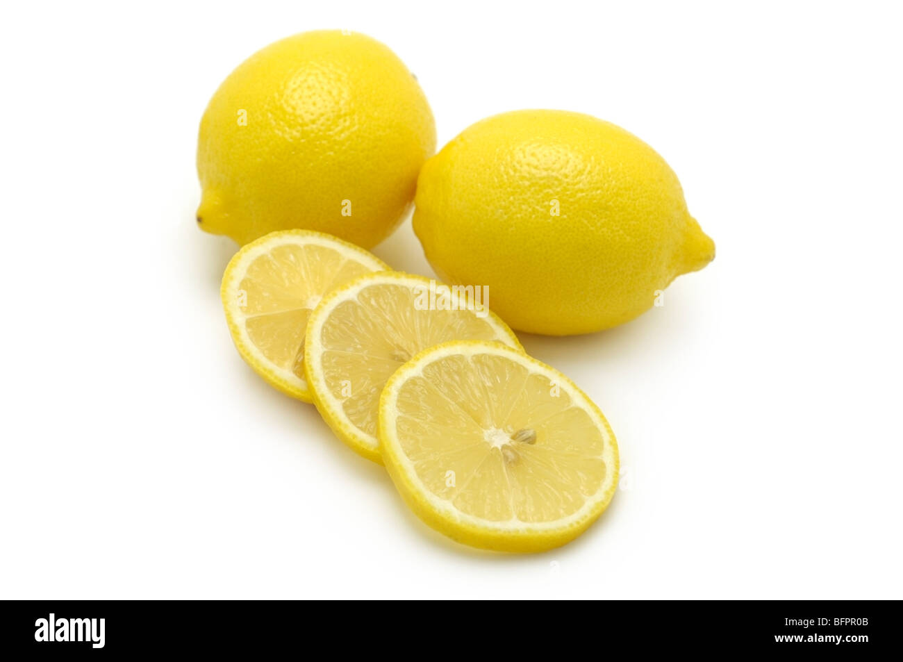 Whole Lemons and Slices Stock Photo