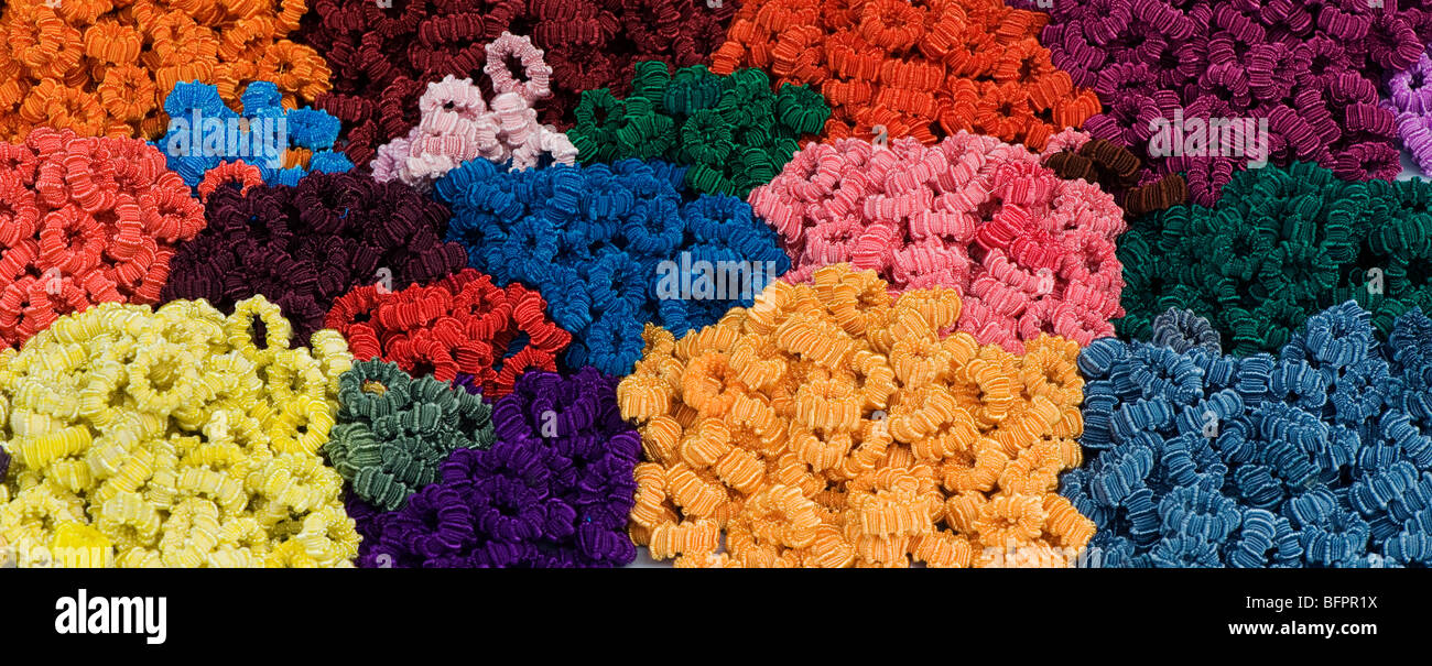 Scrunchies, Hair ties, colourful pattern on an indian market stall. Andhra Pradesh, India Stock Photo