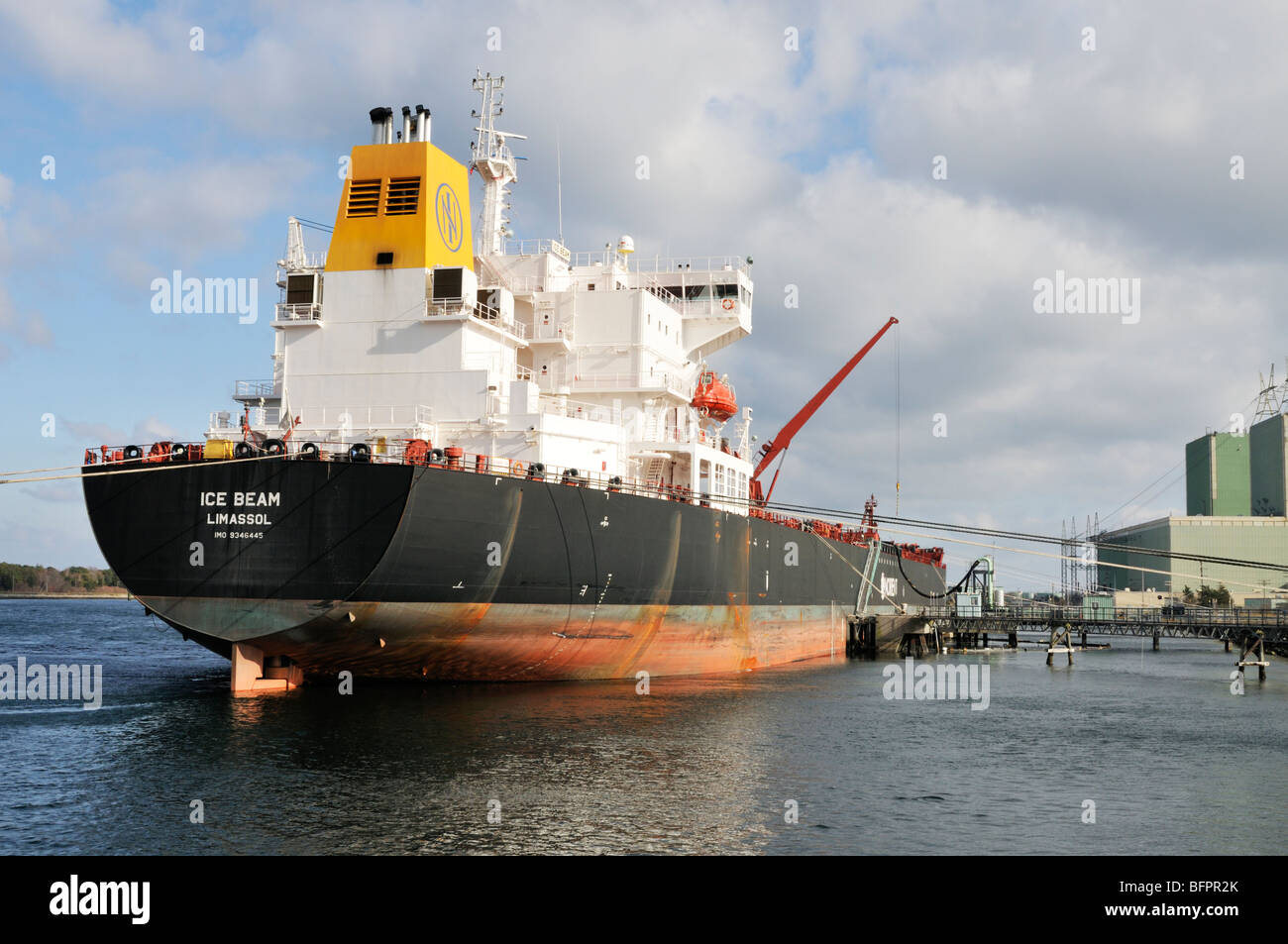 Crude oil tanker, Ice Beam, tied up to pier at Mirant Power Plant in the Cape Cod Canal to offload oil Stock Photo