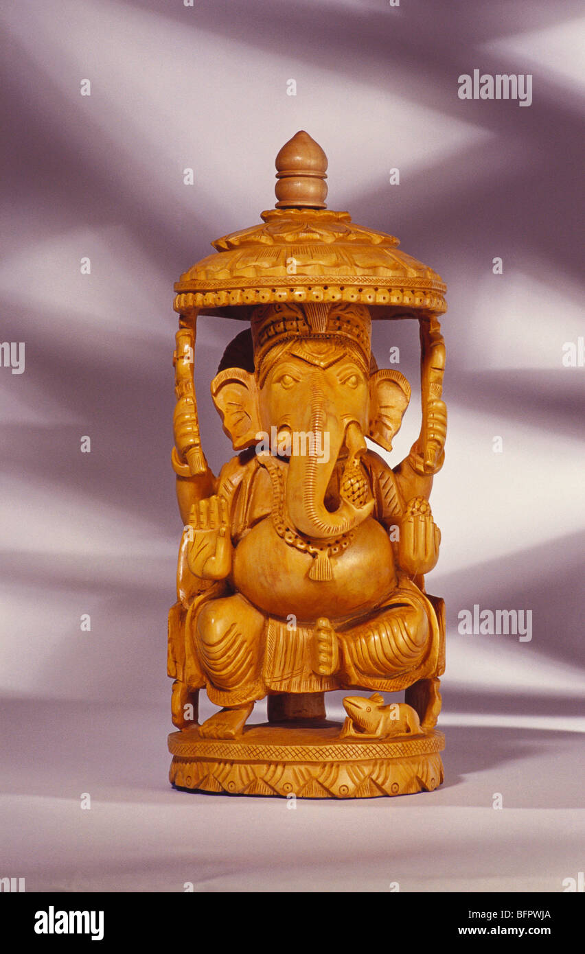 VDA 66416 : Idol of god Ganesh elephant headed in cedar wood painted Stock Photo