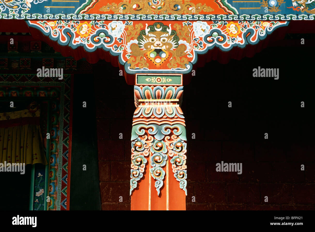Painted pillar of Tibetan Sechen Tennyi Dargyeling Najingmapa Buddhist monastery ; Bodhgaya ; Bihar ; India Stock Photo
