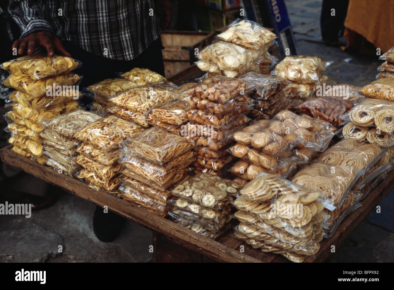 HMA 66607 : Snacks ; banana wafers sold in packets on road side shop ; India Stock Photo