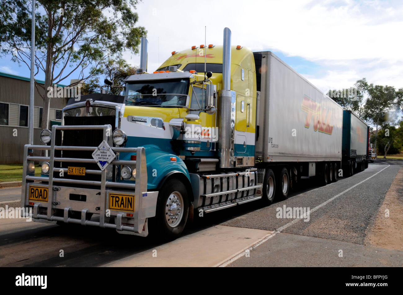 A 190-tonne road train being inspected and its total weight at a weighing station in Alice Springs in the Northern Territory, Australia. Stock Photo