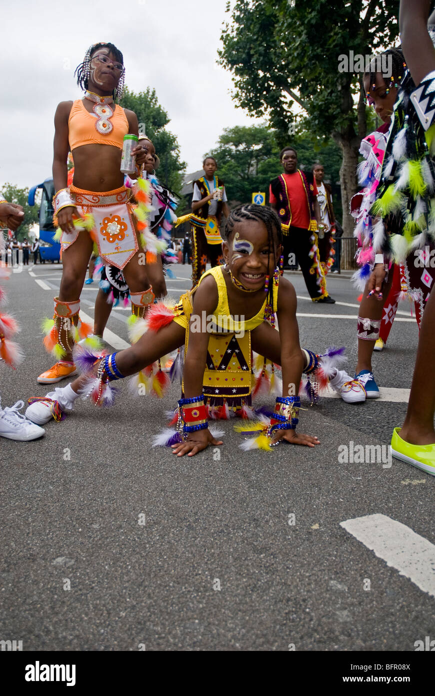 Performers from the Phoenix Carnival Costume Band float the Notting