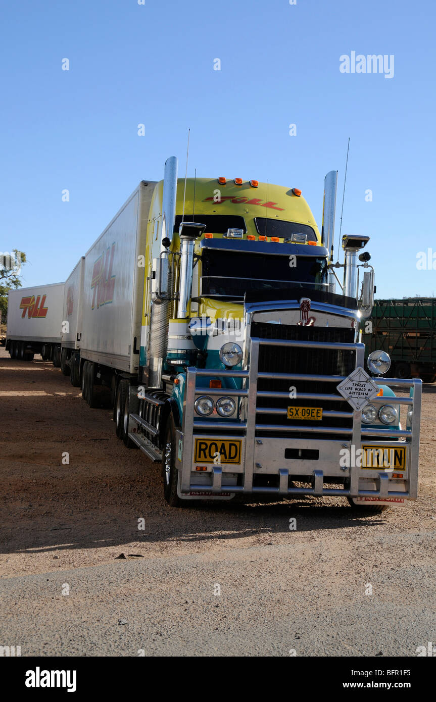 An Australian road train in a lorry park at Alice Springs, one of the few main ‘pit stops’ for its trucker facilities on the Stuart Highway in the Nor Stock Photo
