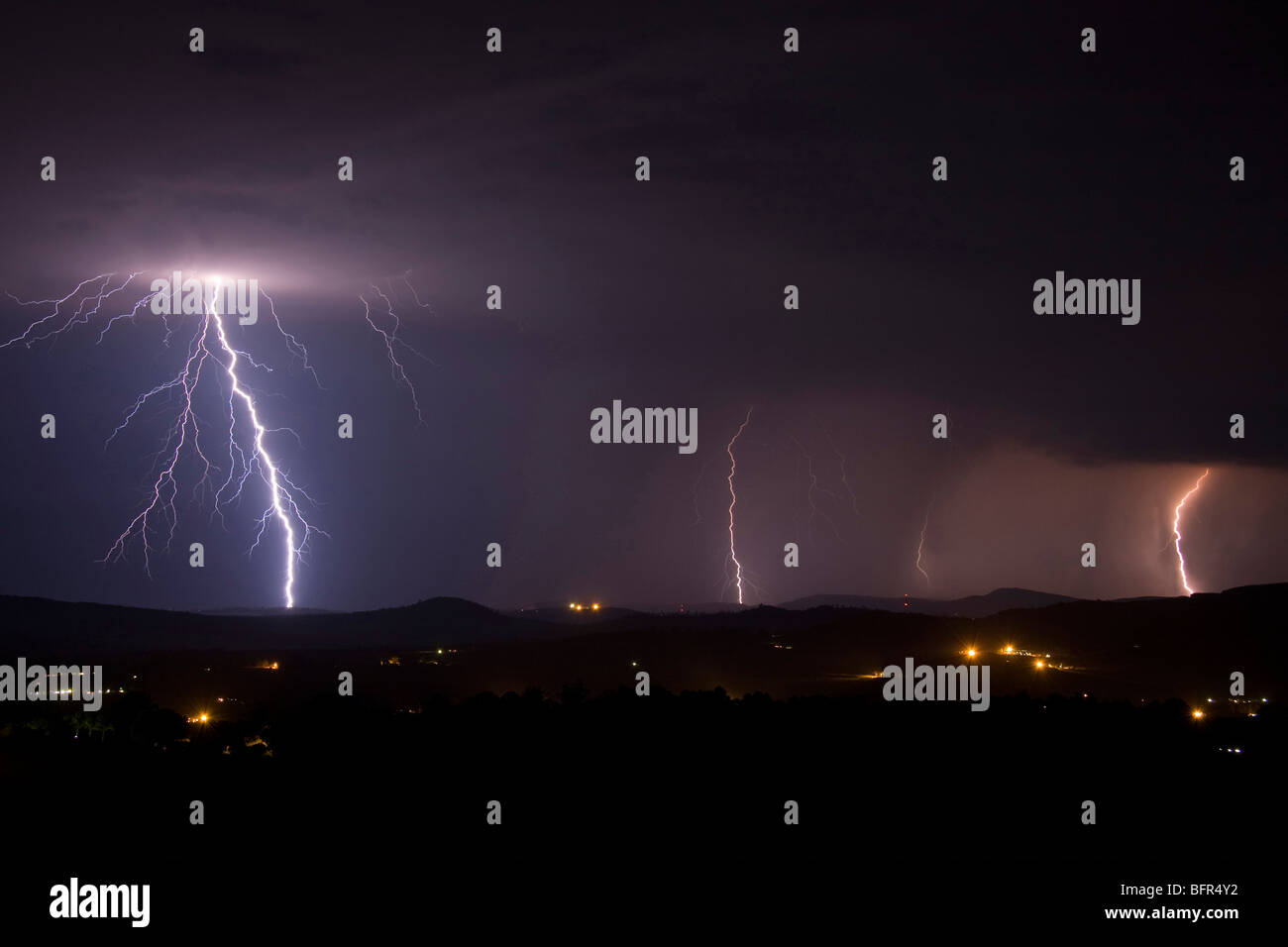 Lightning during a thunderstorm seen from White River Stock Photo
