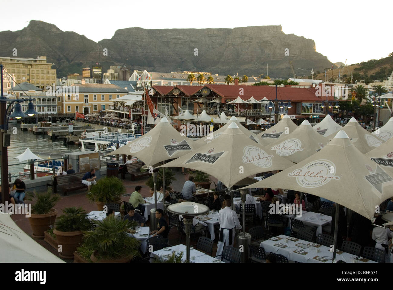 Outdoors restaurant with umbrellas at the Victoria and Alfred Waterfront Stock Photo