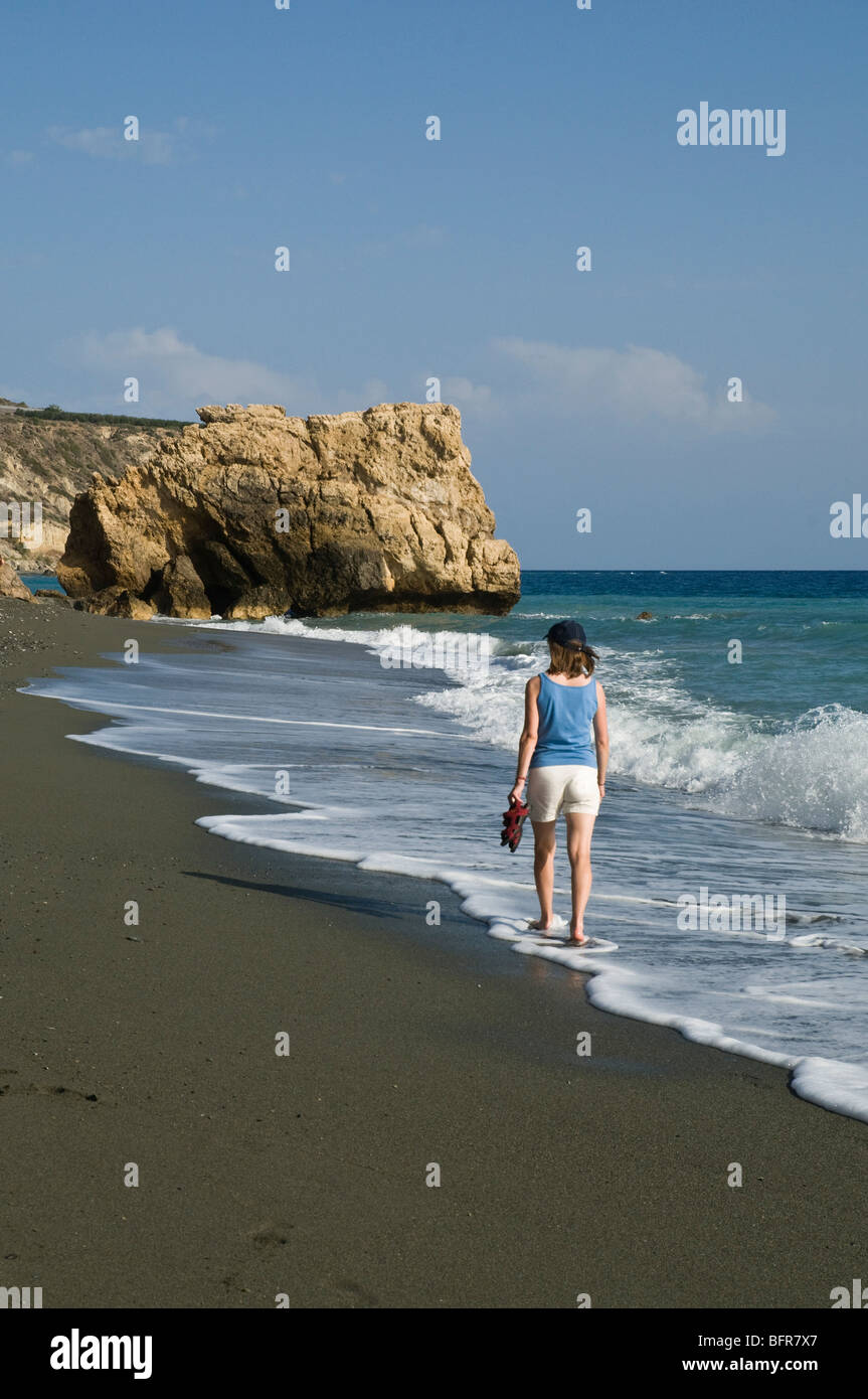 dh Tertsa VIANNOS GREECE CRETE Woman walking in seawaves walking along Tertsa beach young women Stock Photo