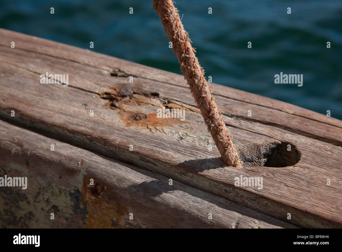 Hole in the side of a boat with rope coming out of it Stock Photo Alamy