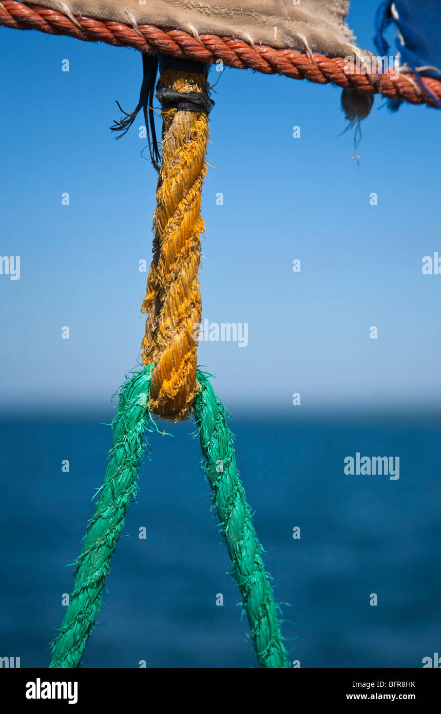 Colourful rope attached to sail Stock Photo