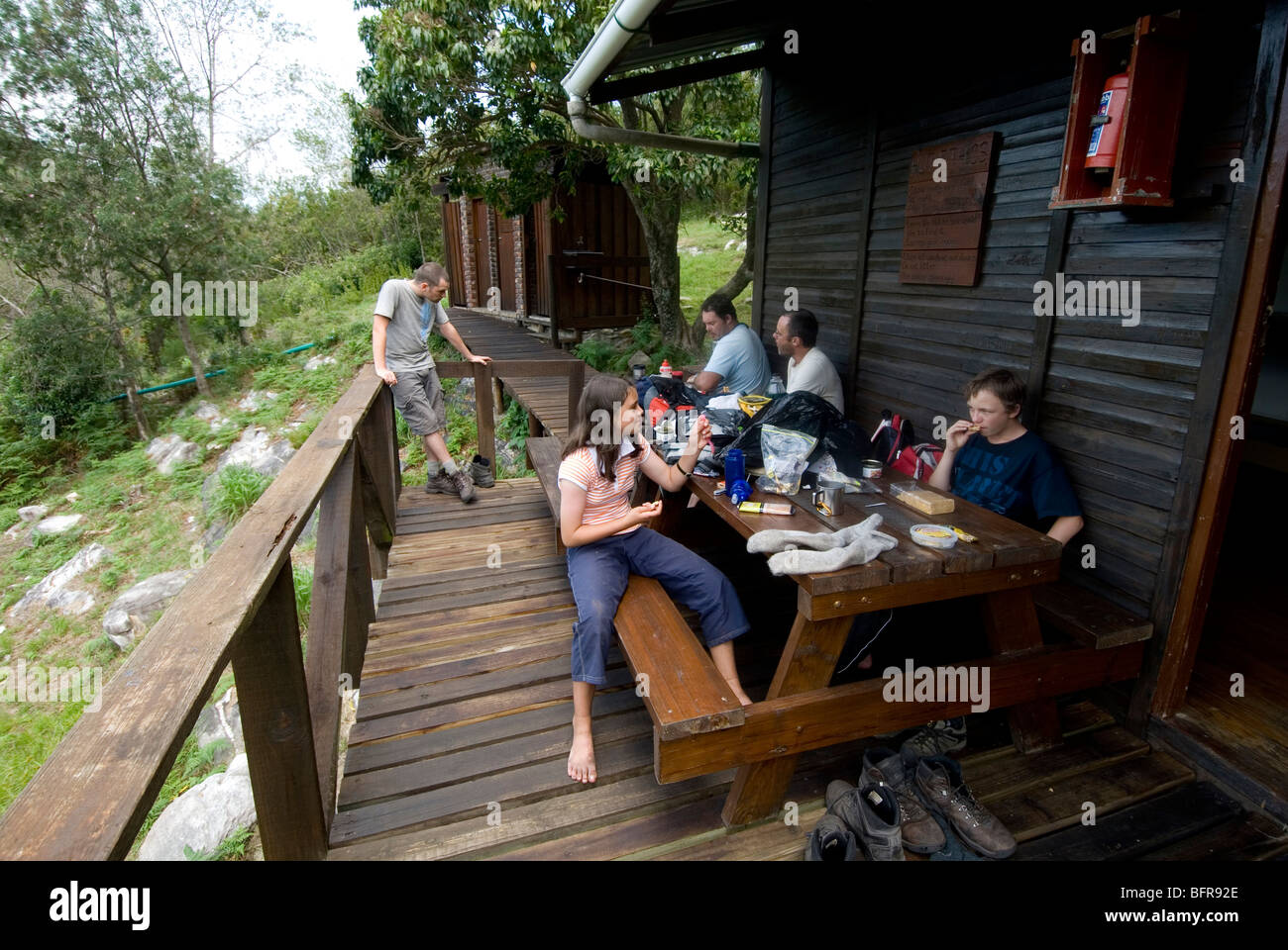 Hikers resting at final Hut (SleepKloof) Tsitsikama Hiking Trail Stock Photo
