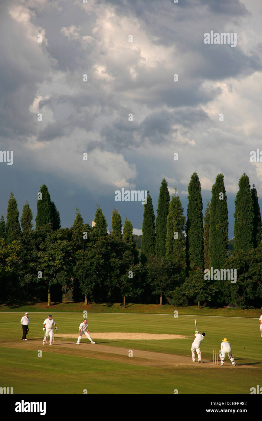 A game of cricket with an approaching summer storm Stock Photo
