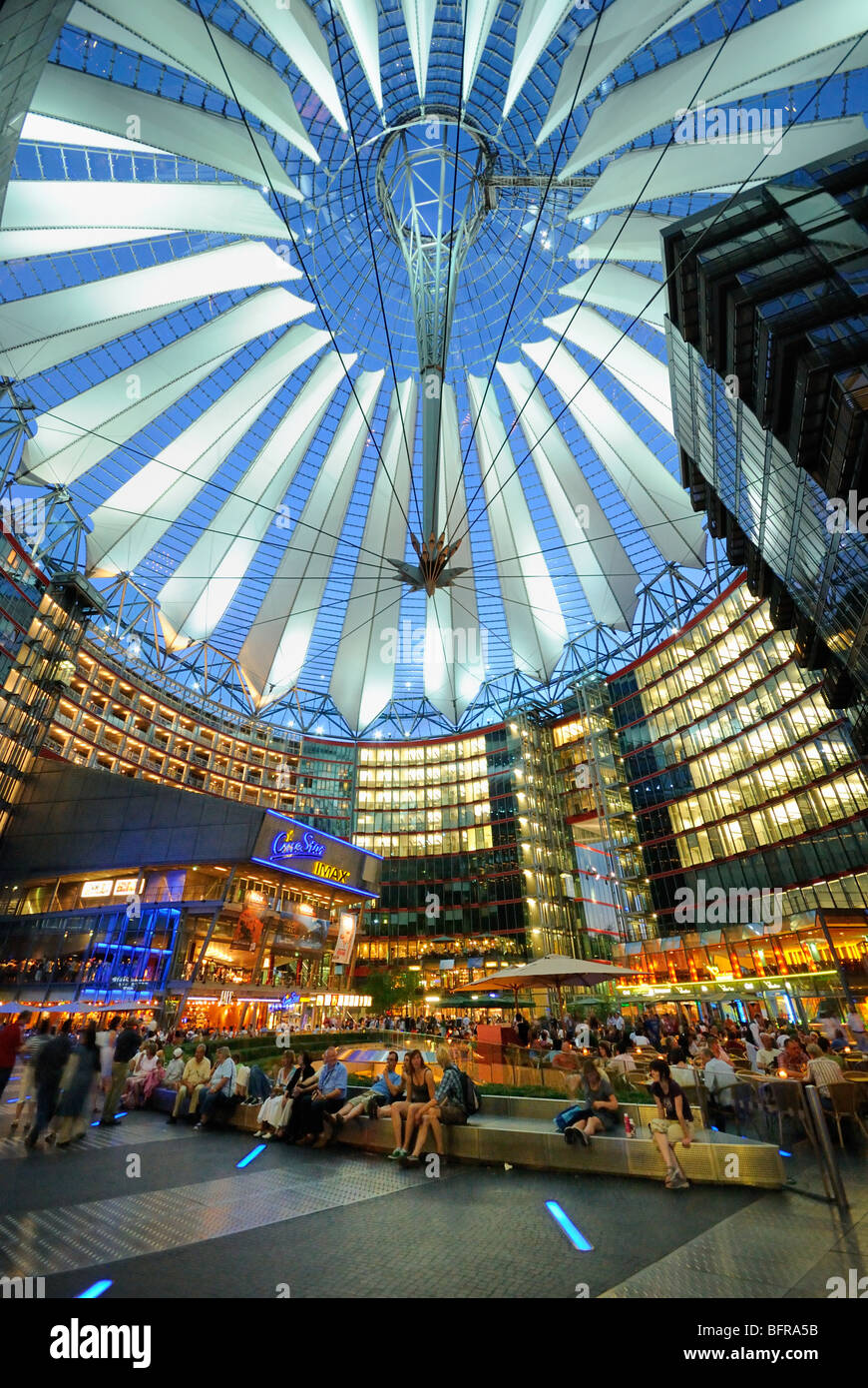 Atrium and interior of Sony Center. Restaurants and cafes under the tent roof on a summer night. Potsdamer Platz. Berlin. Stock Photo