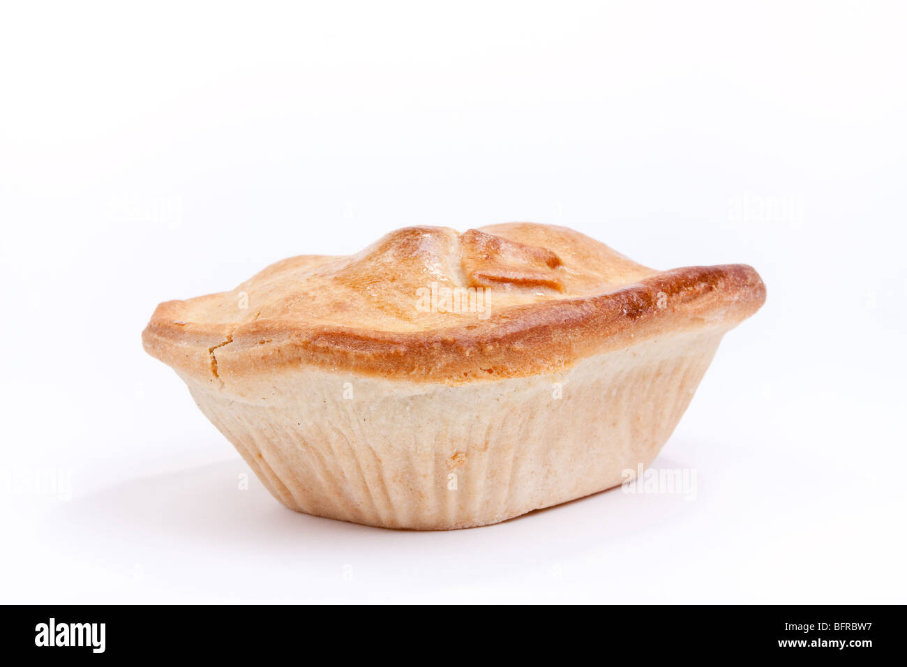 Individual short crust pastry steak pie isolated against white background Stock Photo