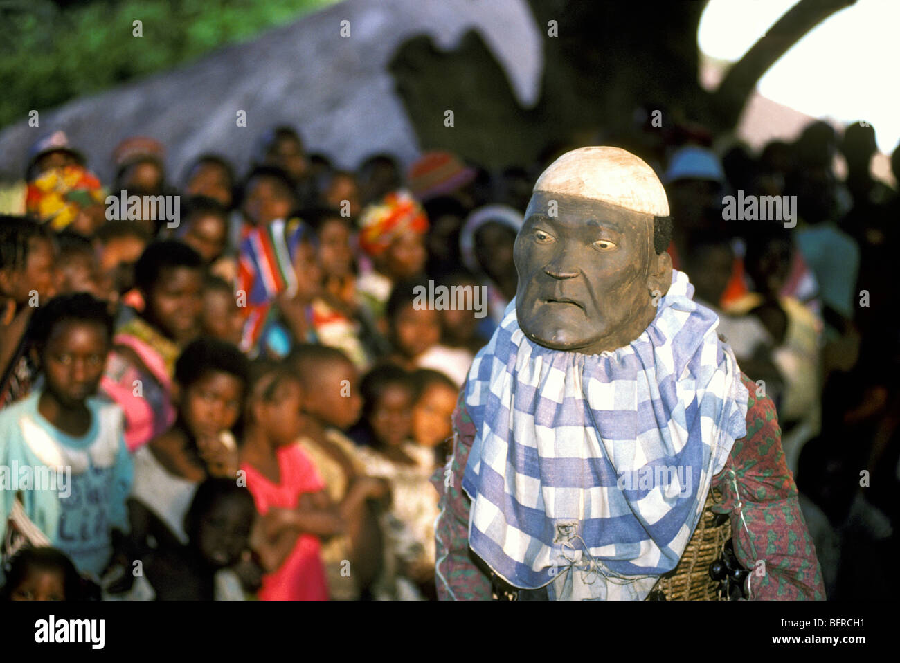 Mapico dancer Rafaela Rafigi of the Makonde surrounded by onlookers Stock Photo