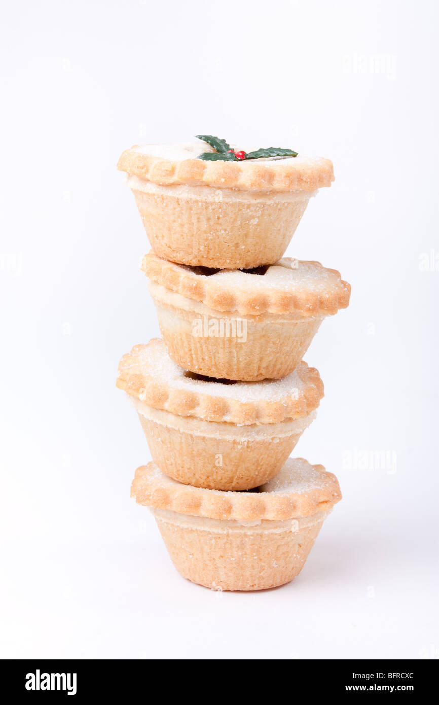 Tower of sugared Sweet Mince Pies against plain white background. Stock Photo