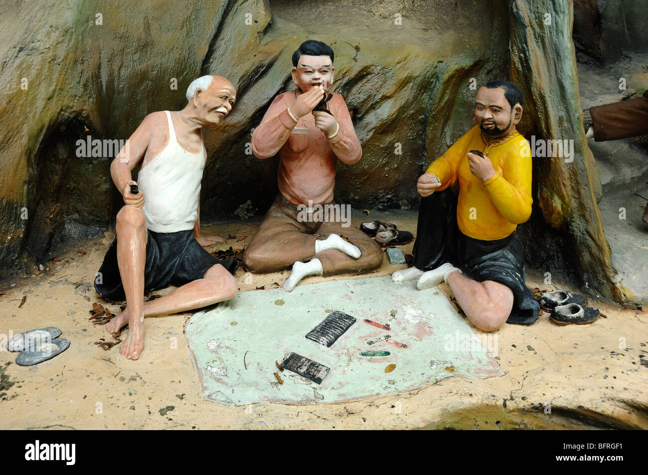 Chinese Gamblers Playing Mahjong or Gambling Scene, 'Gambling Can Cost You Everything' Morality Tale, Tiger Balm Gardens Chinese Theme Park,Singapore Stock Photo