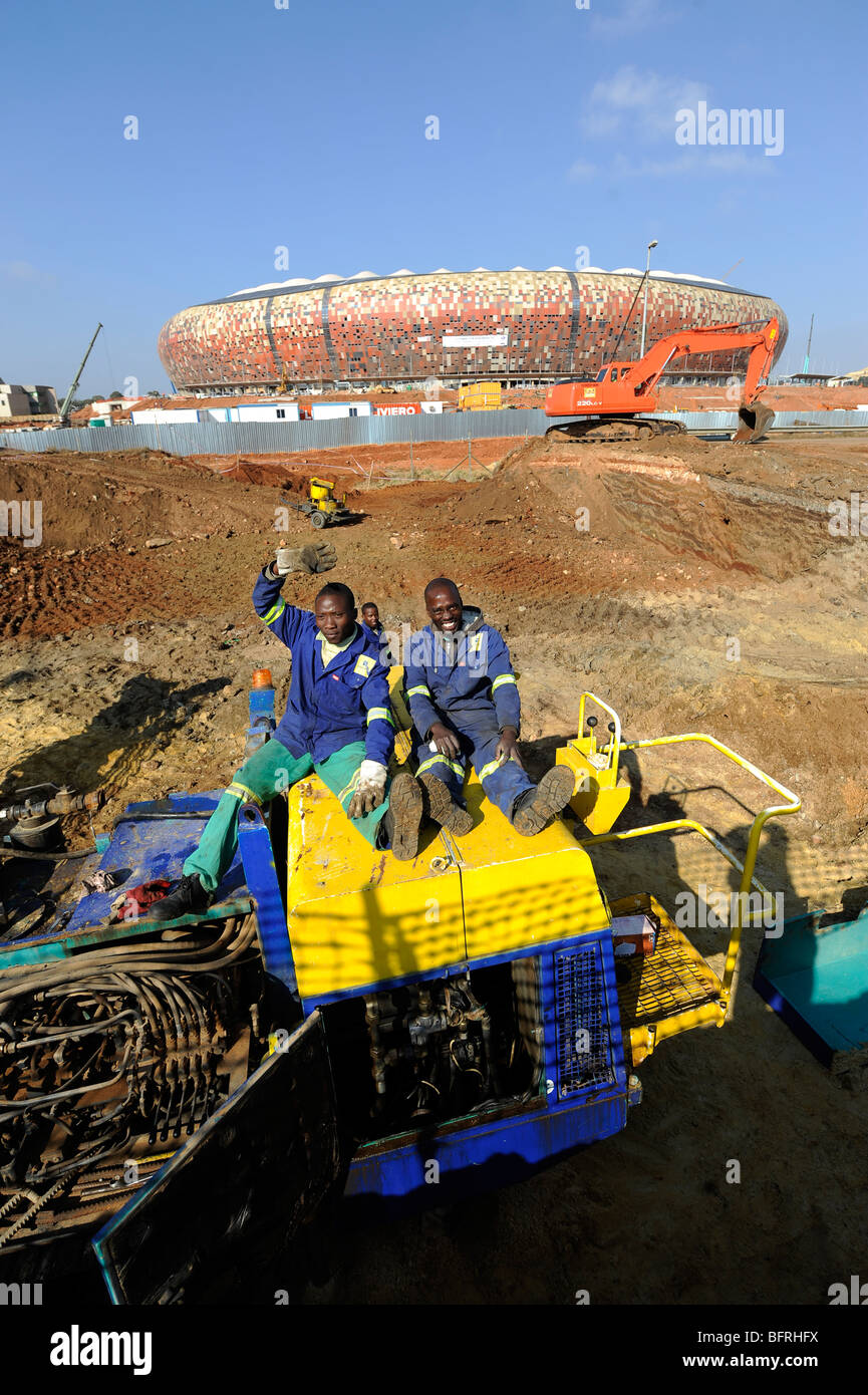 Two construction workers at Soccer City Stadium in South Africa - venue for 2010 FIFA World Cup in Johannesburg, South Africa Stock Photo