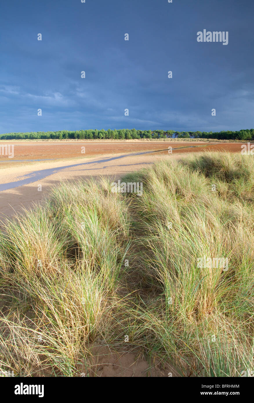 Holkham Bay & sand dunes during a passing storm on the North Norfolk Coast, UK Stock Photo