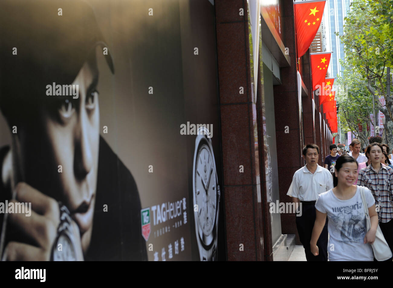 Image of American golfer Tiger Woods on a western product billboard face  Chinese people in Shanghai, China. Stock Photo