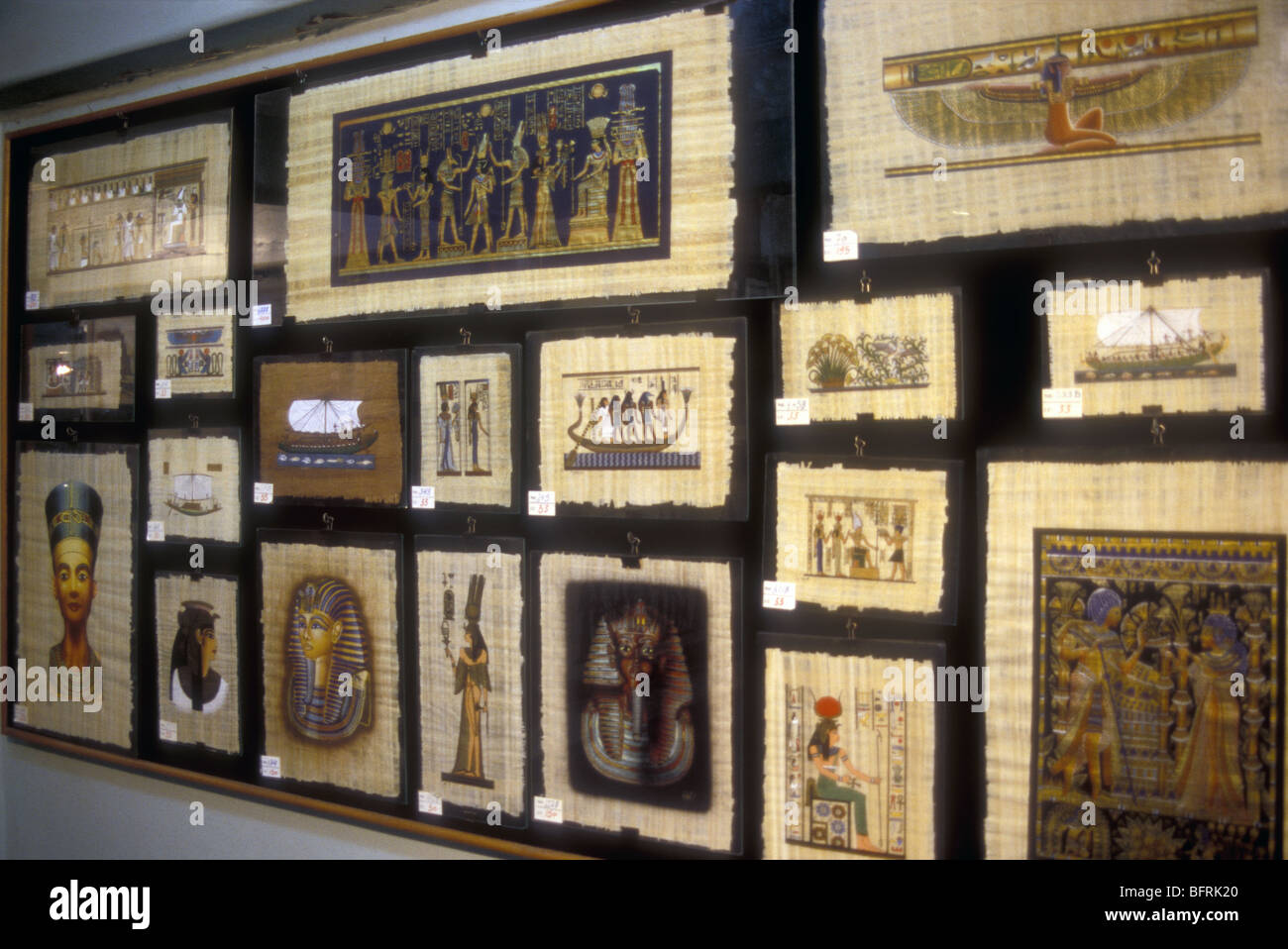 Samples of pictures and designs made on papyrus on sale at factory between Giza and Cairo Egypt north Africa Stock Photo