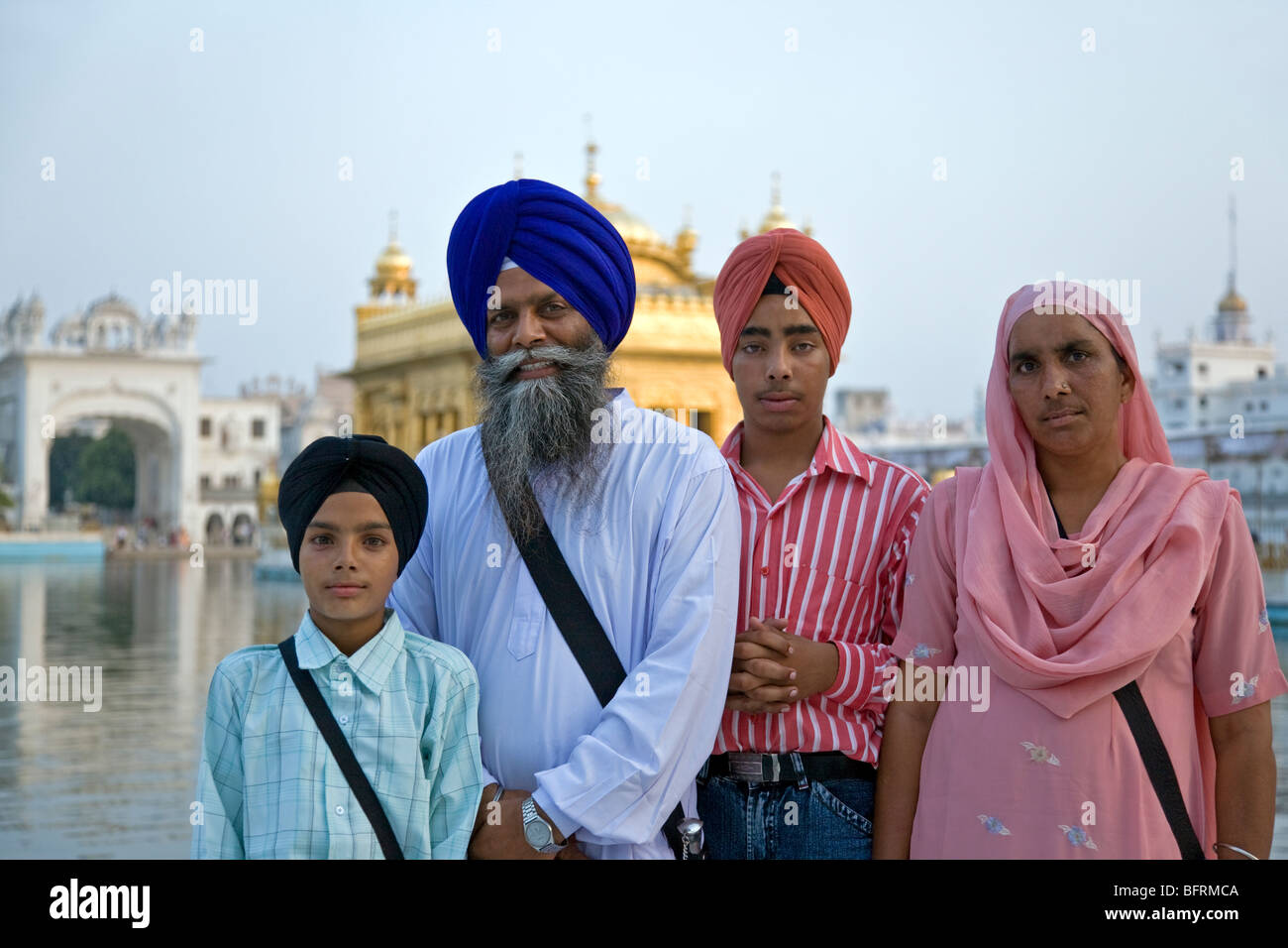 Sikh Family At The Golden Temple Amritsar Punjab India Stock Photo 