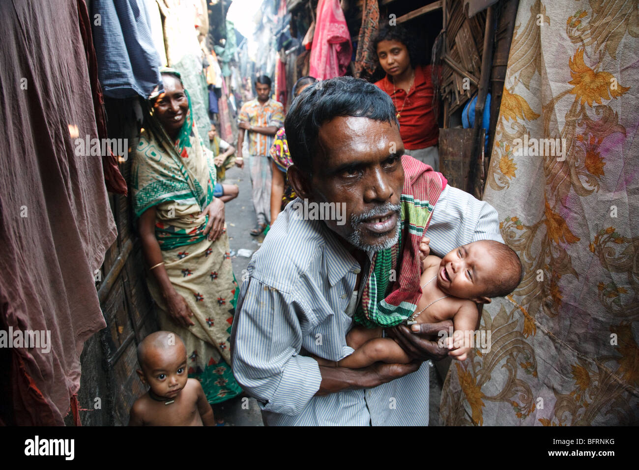 A scene from a daily life of a family living in one of the slums in Kolkata, India Stock Photo