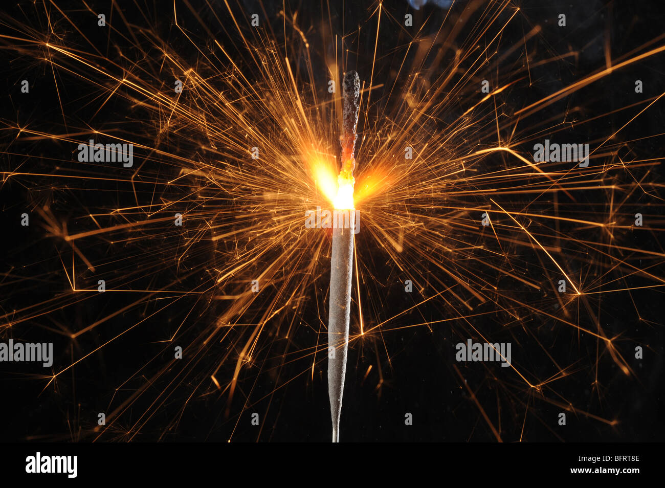 Abstract image of burning sparkler with dark background Stock Photo