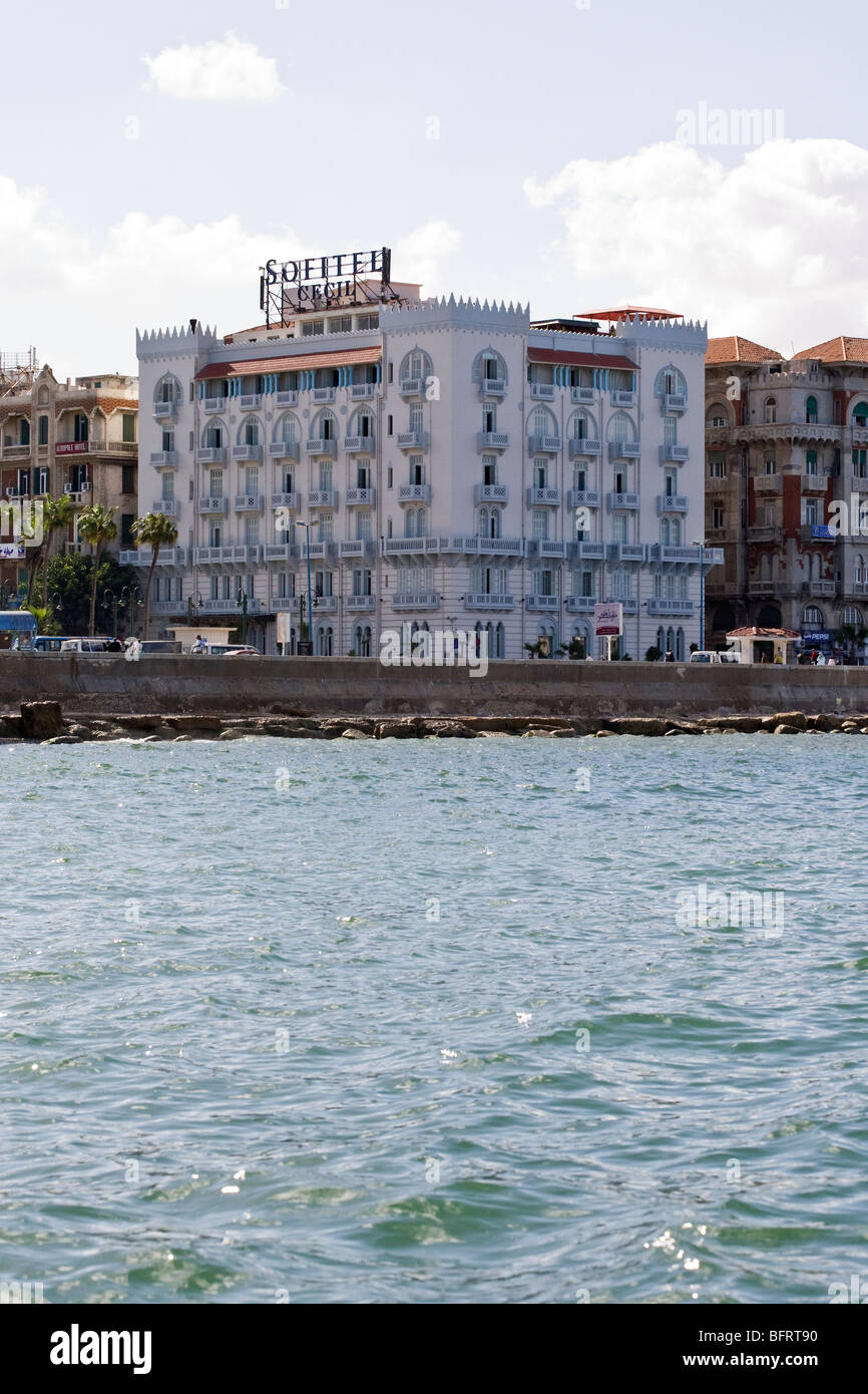 The Sofitel Cecil Hotel on the corniche in Alexandria, Egypt seen from a boat in the harbour. Stock Photo