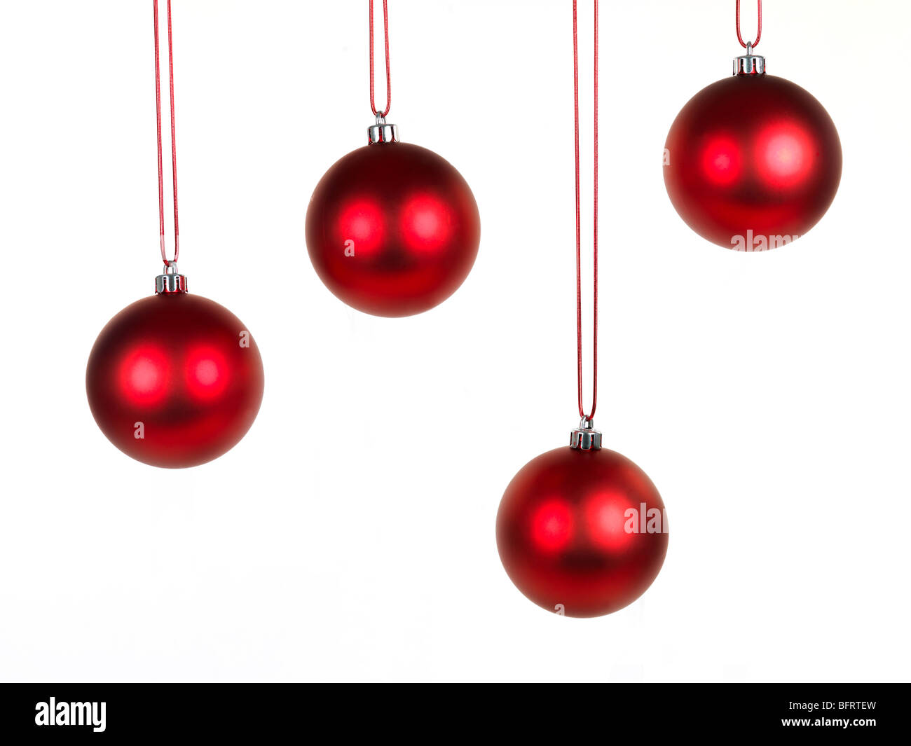 Hanging Christmas ornaments isolated against a white background Stock