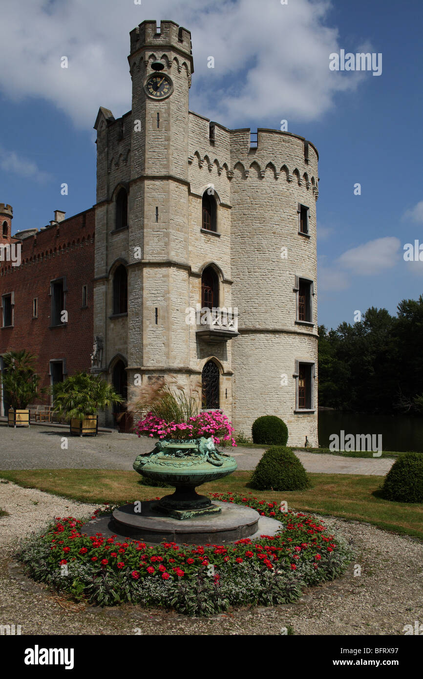 Stone tower of Bouchout Castle with flower planter at the National