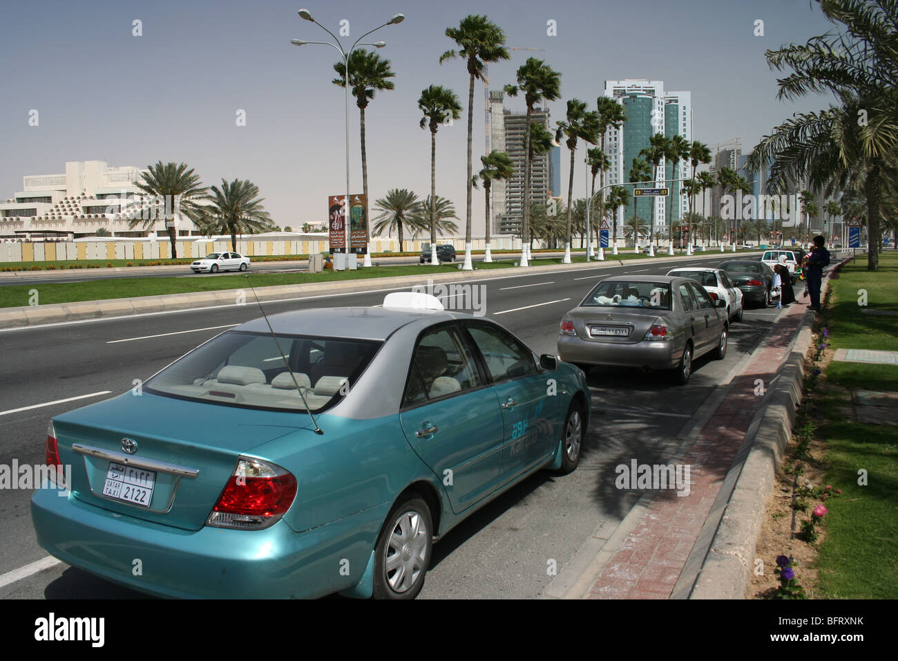 Doha Corniche Qatar Skyline Parked cars main road Stock Photo