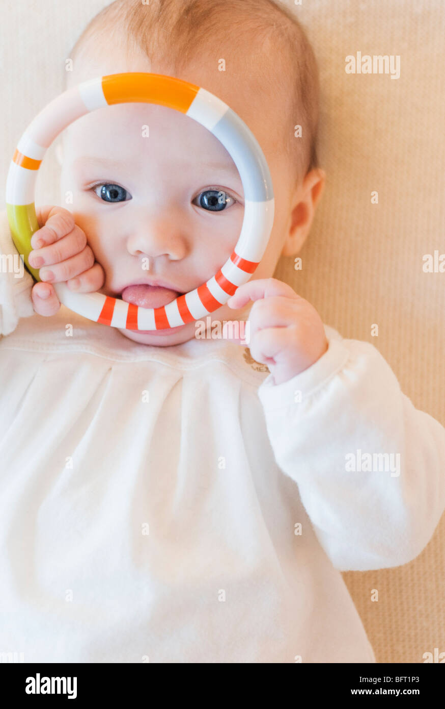 Baby with Teething Ring Stock Photo Alamy
