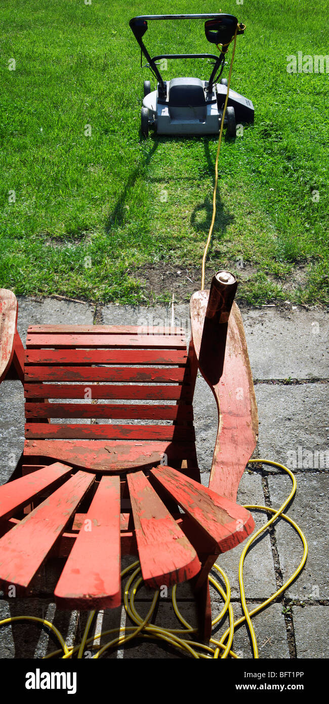 Lawnmower and Lawn Chair with Beer Can Stock Photo Alamy