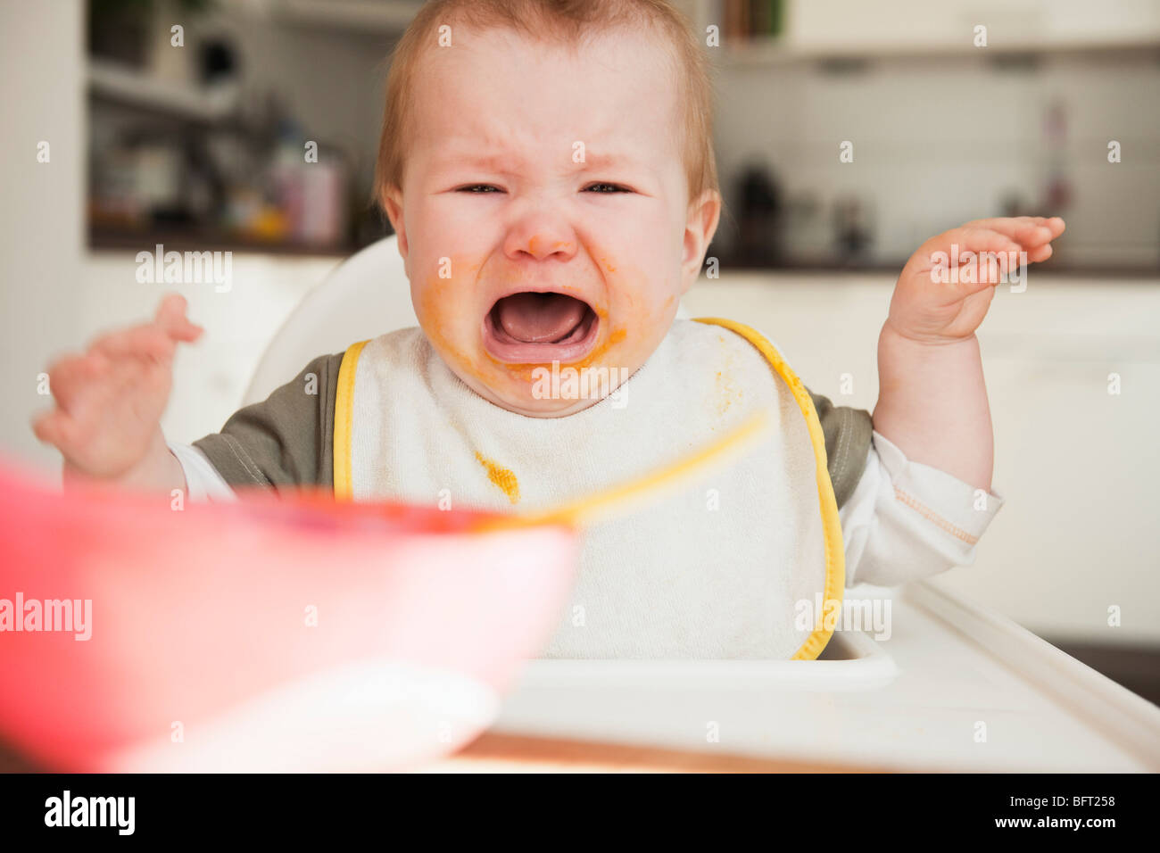 Crying Baby in High Chair Stock Photo