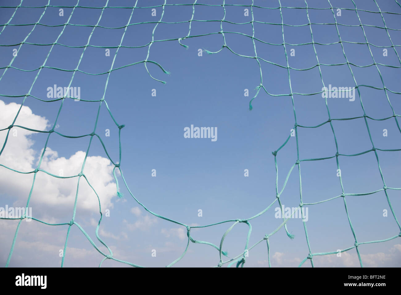 Hole in Soccer Net Stock Photo Alamy