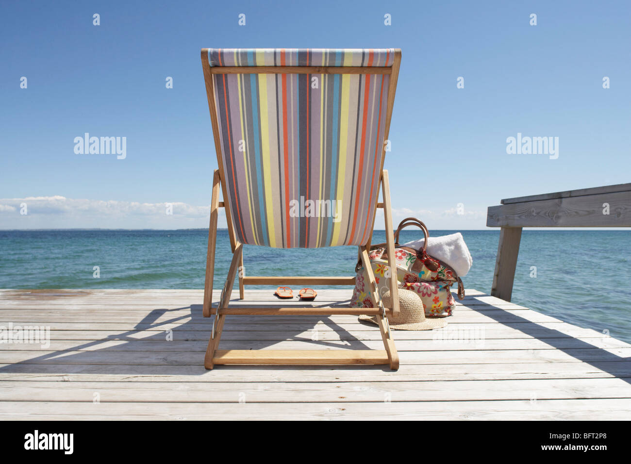 Canvas Beach Chair on Dock Stock Photo Alamy