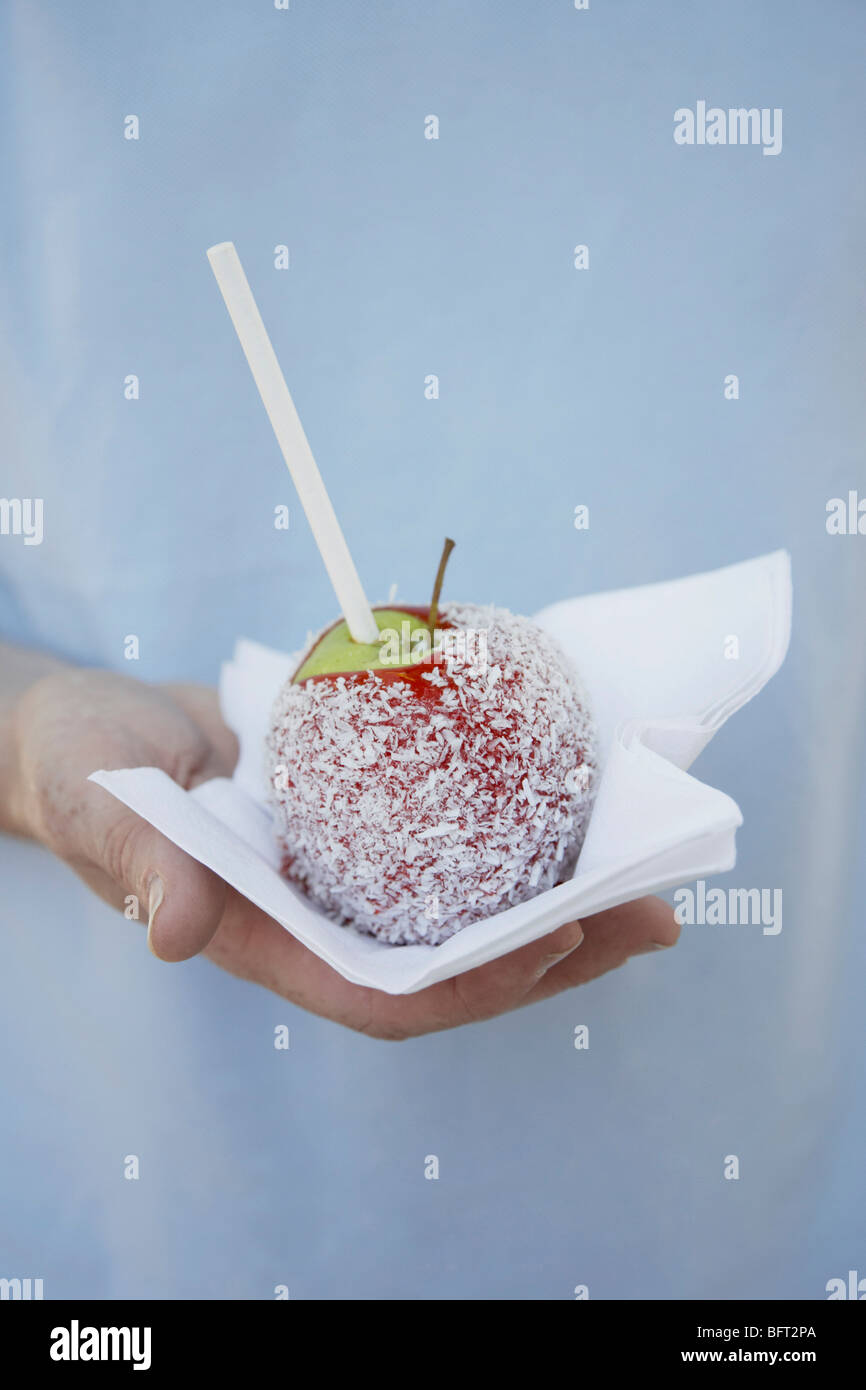 Person Holding Candy Apple Stock Photo