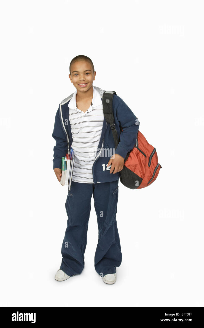 Boy with School Bag and Books Stock Photo