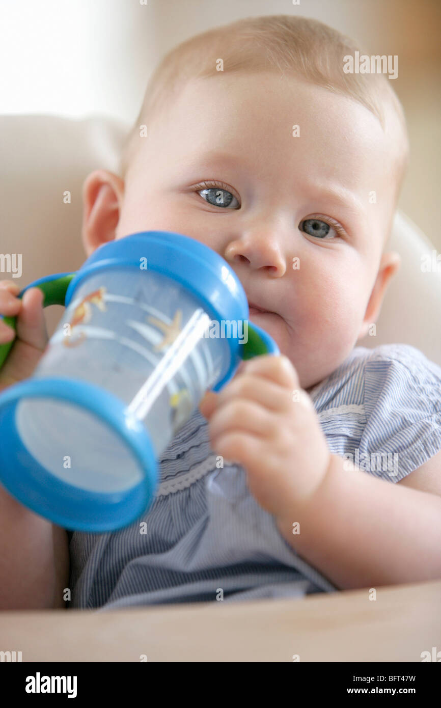 Baby Girl With Sippy Cup Stock Photo