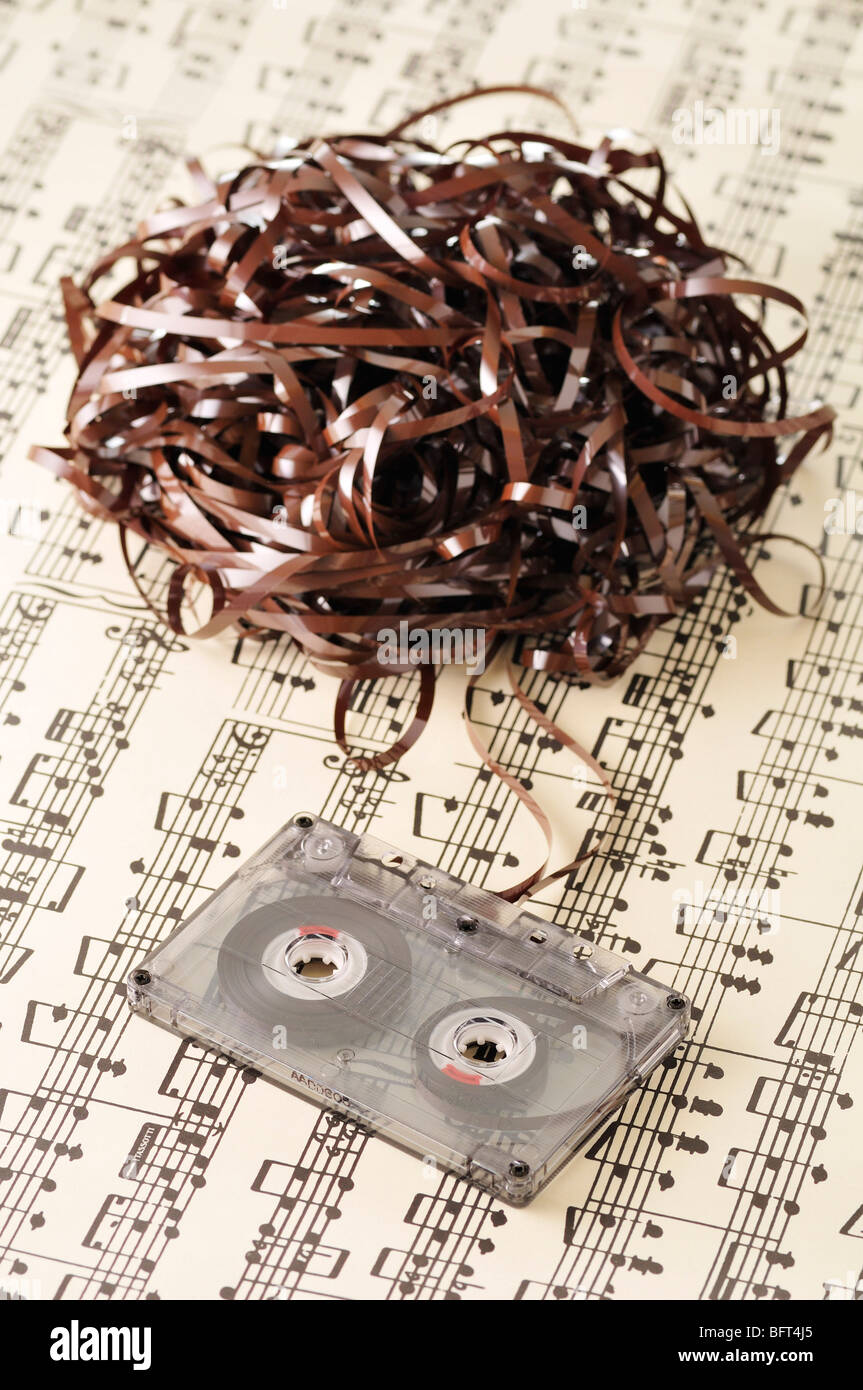 Unravelled Cassette Tape on Sheet Music Stock Photo Alamy