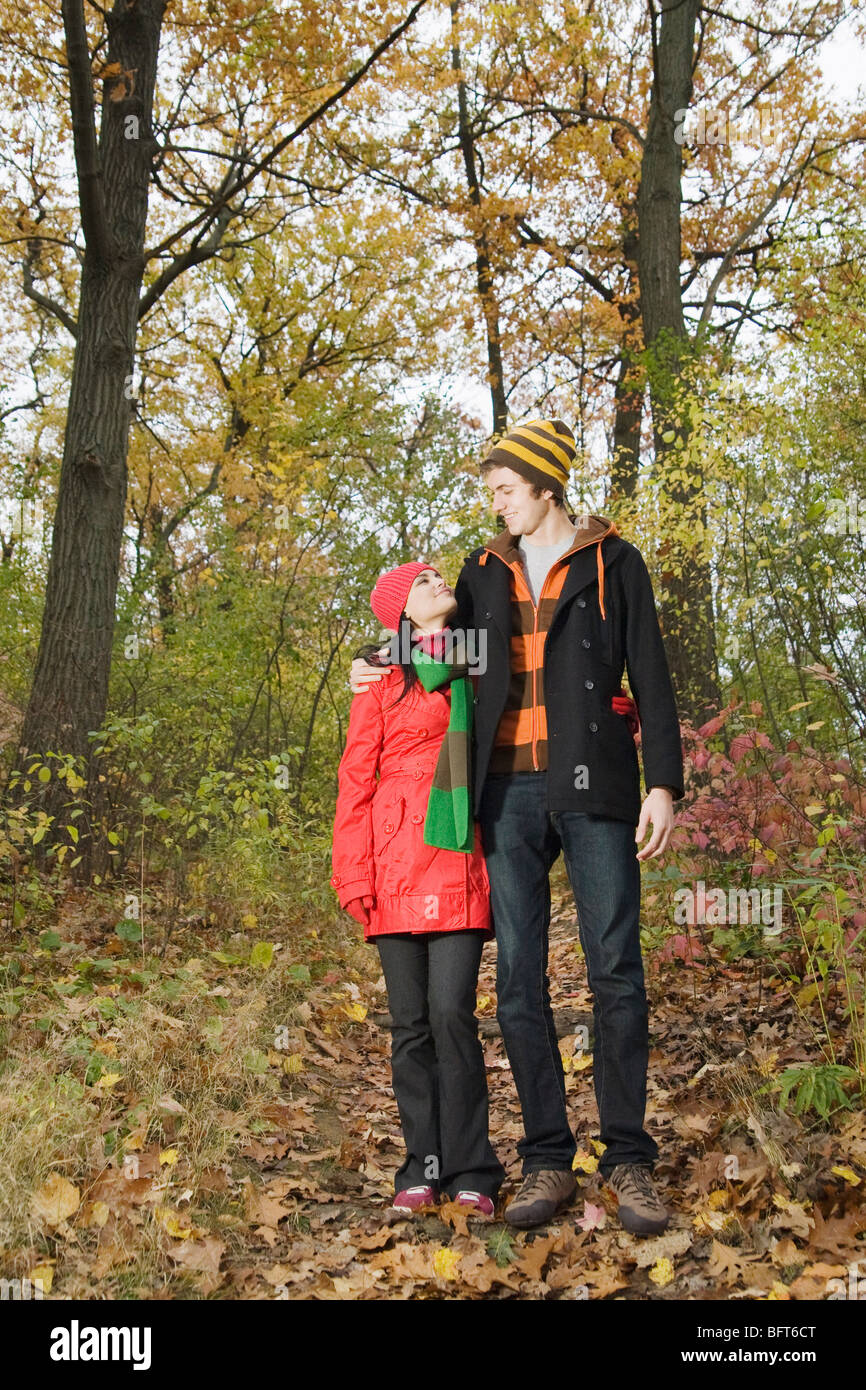 Couple Walking in Forest in Autumn Stock Photo - Alamy