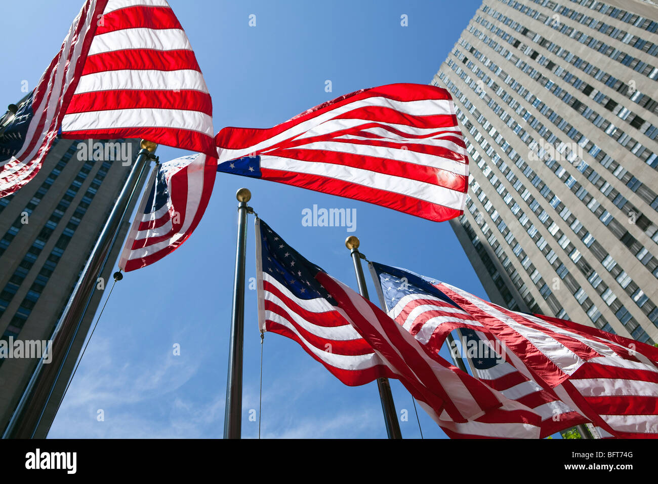 American Flags at Rockefeller Center, GE Building in the Background, NYC, New York, USA Stock Photo