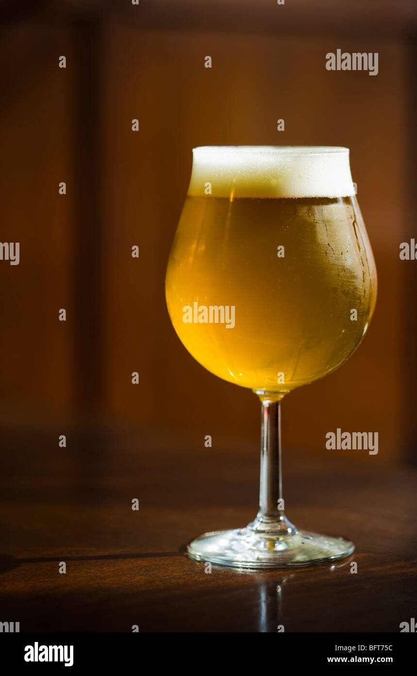 Glass of Beer on Bar Counter Stock Photo