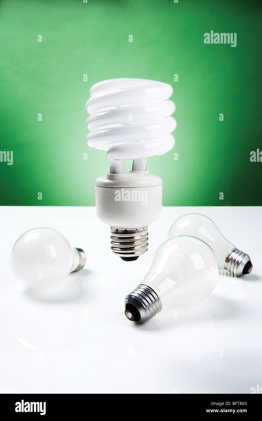 Compact Fluorescent Lightbulb with Incandescent Lightbulbs Stock Photo