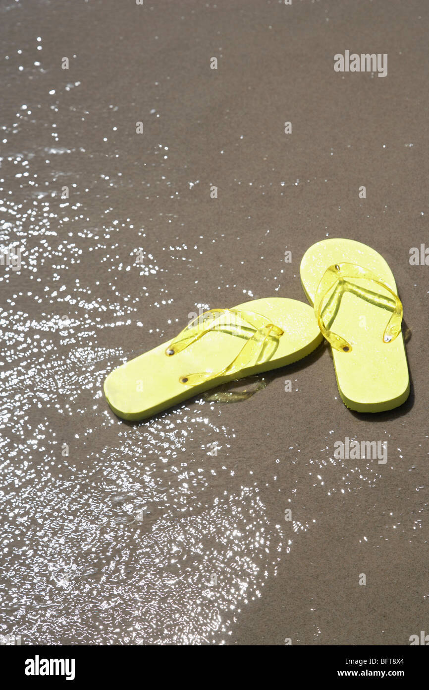 Flip Flops on Beach Stock Photo - Alamy
