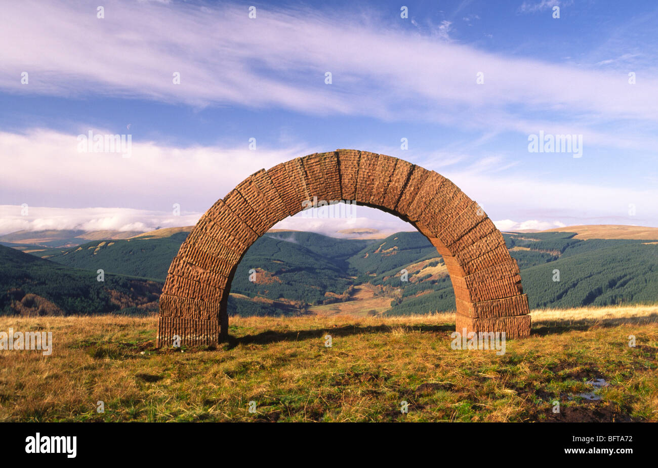 Enviromental artwork artist Andy Goldsworthy sculpture Striding Arch on Bail Hill near Moniaive Scotland UK Stock Photo