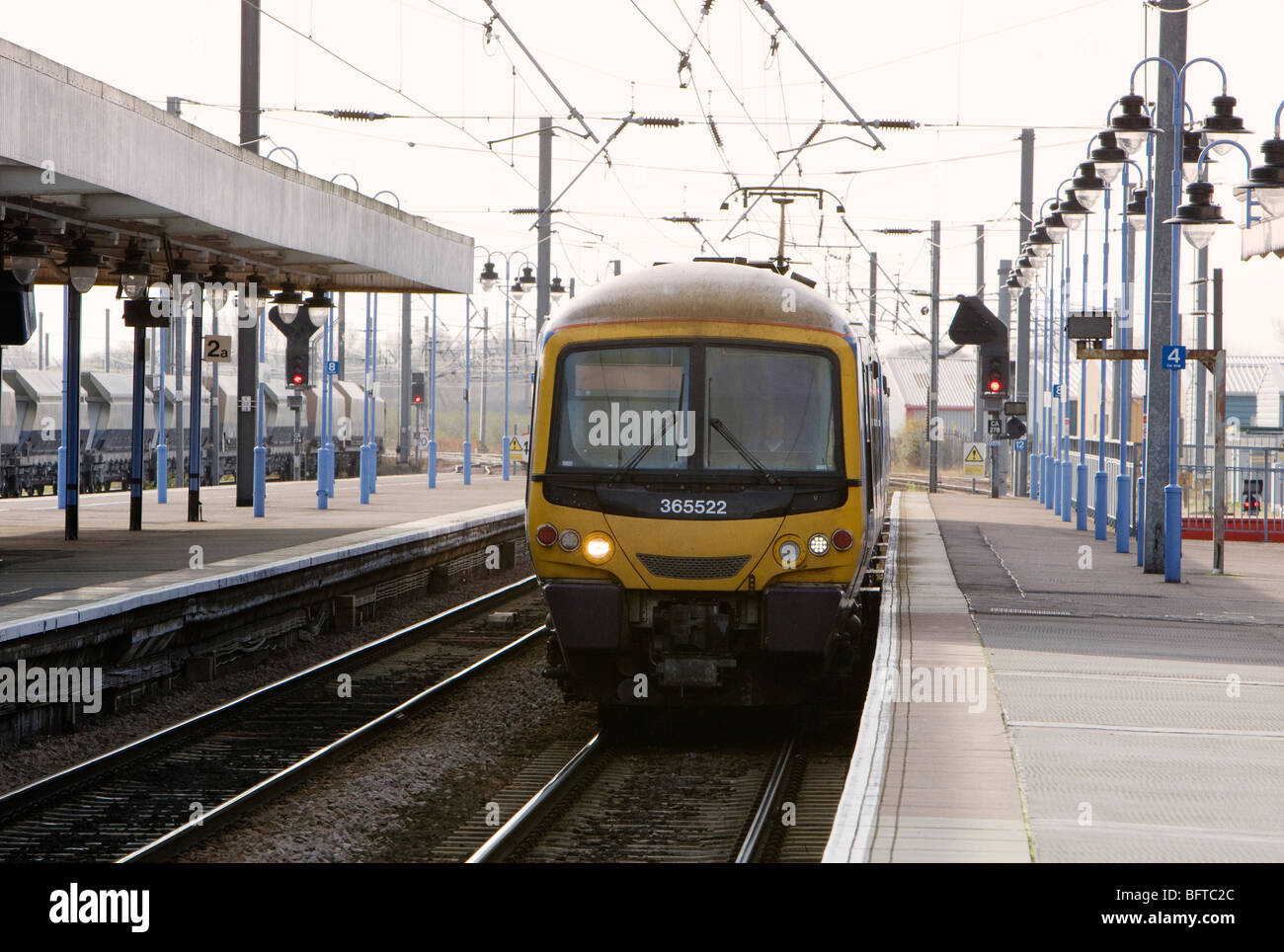 An electric passenger train from King's Cross pulls in to Ely station in Cambridgeshire, UK Stock Photo