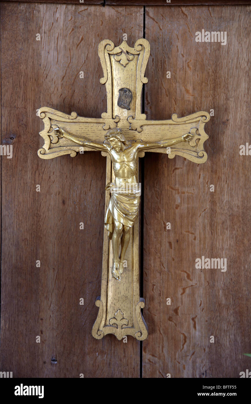 Golden crucifix with image of Jesus Stock Photo