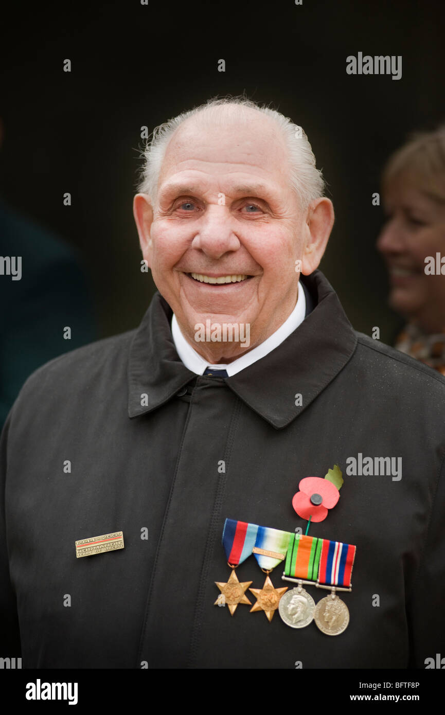 An old soldier wearing his campaign medals smiling on Remembrance Day Parade in Central London, UK Stock Photo